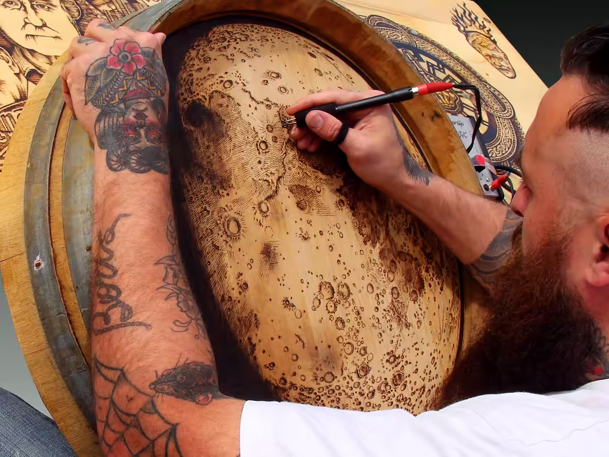 Close-up of hand-burned pyrography process